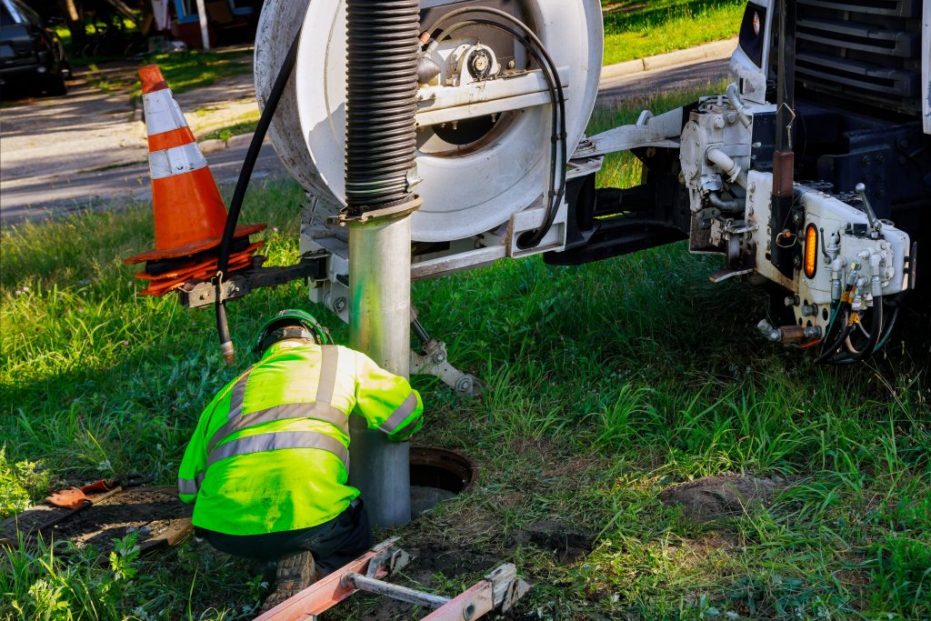 Cleaning the sewer system special equipment on utility service in the town.